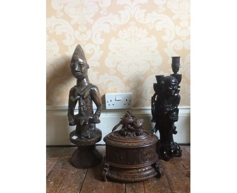 A 20th Century African tribal carved figure of a woman with a child, a Chinese carved figural table lamp and a 19th Century c