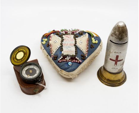 World War One interest: a sweetheart pin cushion, A small patchwork of silk flags etc approx 50 cms x 60 cms, a shell shaped 