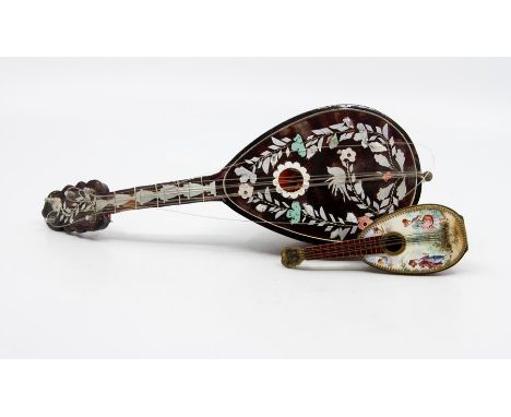 An enamel and hand painted gilt metal mandolin, the exterior front painted with a scene of young man and woman and two angels