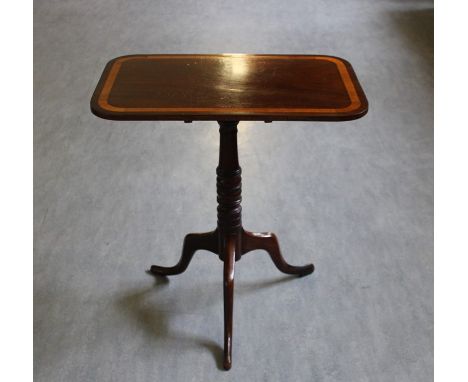 A late Georgian mahogany table, tilt top tripod table, satinwood edge to top