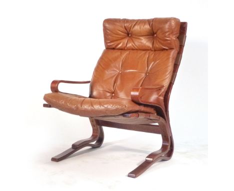 Ingmar Relling for Wesnofa, A tan and button upholstered lounge armchair on a bentwood frame CONDITION REPORT: missing some b