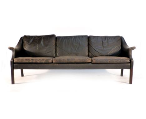 A 1970's brown three seater sofa on mahogany straight legs together with a matching armchair CONDITION REPORT: Extensive wear