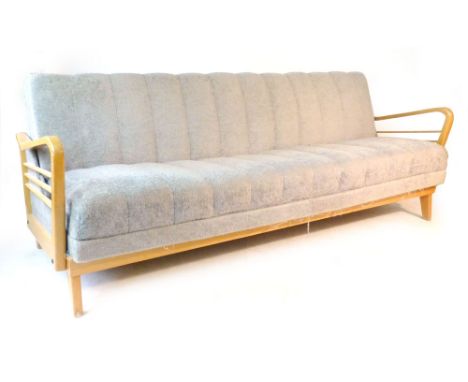 A 1950/60's beech and upholstered sofa bed with arms of organic form CONDITION REPORT: Length 203 cm. Depth 86 cm. Height 80 