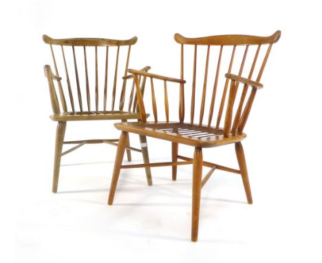 A pair of stained beech stick back armchairs on tapering legs, in the manner on Borge Mogensen CONDITION REPORT: loose uphols