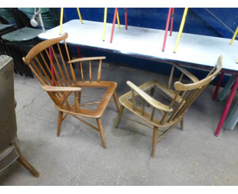 A pair of stained beech stick back armchairs on tapering legs, in the manner on Borge Mogensen CONDITION REPORT: No upholster