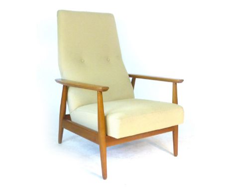 A 1970's beech and button upholstered platform rocker on circular tapering feet