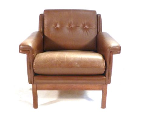 A 1970's brown and button upholstered lowback lounge armchair on an oak frame CONDITION REPORT: No obvious rips or cracks but