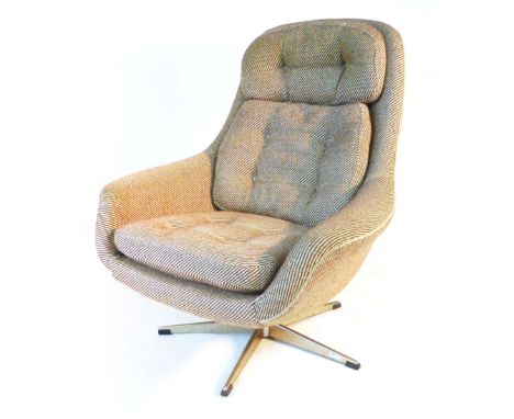 A 1970's oatmeal and button upholstered armchair on an aluminium five star base