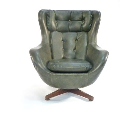 A 1970's green vinyl and button upholstered egg-type chair a teak four star base