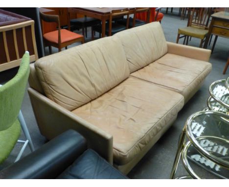 A 1970's tan leather two-section four seater sofa by Dux