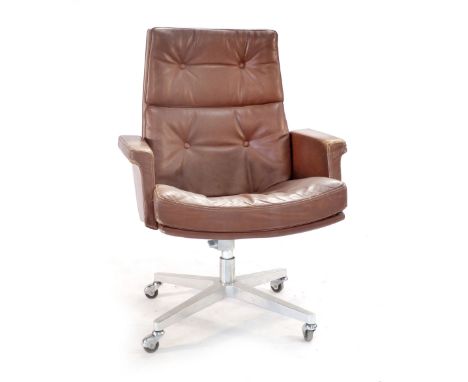 A 1970's brown and button upholstered office armchair on a chromed four star base by Norma Europ CONDITION REPORT: some disco