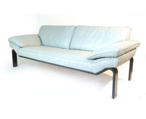 An Ekornes three seater sofa with grey leather upholstery on a black ash frame CONDITION REPORT: Amended Condition Report: so