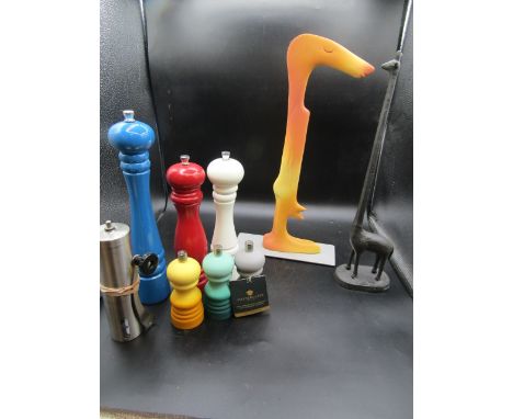 El Corte Ingles kitchen item (knife sharpener?) a metal giraffe kitchen roll holder and an assortment of s&amp;p grinders