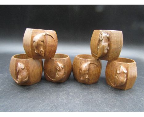 A set of six 'Mouseman'&nbsp; oak napkin rings, the exteriors of octagonal form 4.5cmH