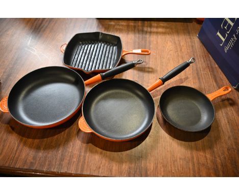 3 Le Crueset cast iron frying pans and 1 skillet pan