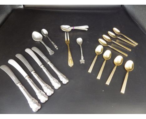 E.P.N.S plated knives and spoons plus a dutch demitasse spoon and a 23/24 Karat Hartvergoldet (plated) German cocktail fork.