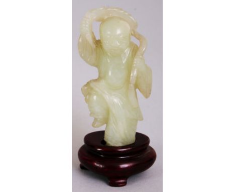 A 19TH/20TH CENTURY CELADON JADE FIGURE OF A DANCING BOY, together with a fitted wood stand, holding behind his head a string