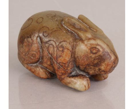 A CHINESE DARK CELADON JADE CARVING OF A RABBIT, probably early Ming Dynasty, its body incised with scrolling lingzhi, one si