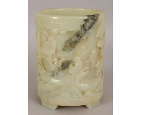 A LARGE GOOD QUALITY CHINESE CELADON JADE BRUSHPOT, the sides decorated in deep relief with a continuous scene of Immortals a