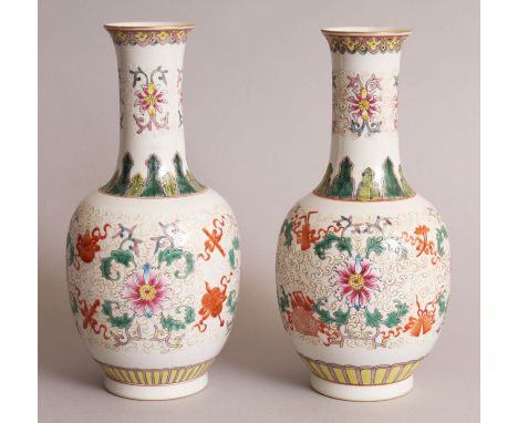 A PAIR OF CHINESE FAMILLE ROSE & BIANCO-SOPRA-BIANCO PORCELAIN VASES, each decorated with ribboned emblems and formal scroll-