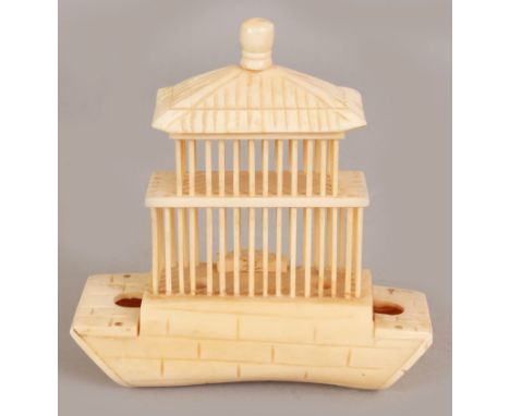 AN UNUSUAL EARLY 20TH CENTURY CHINESE CARVED IVORY MODEL OF A CRICKET CAGE, 4.75in wide & 5.1in high.