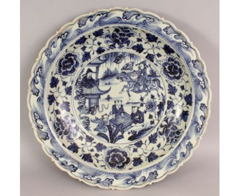 A LARGE YUAN STYLE BLUE & WHITE PORCELAIN DISH, the interior centre decorated with a scene of a man on horseback and children