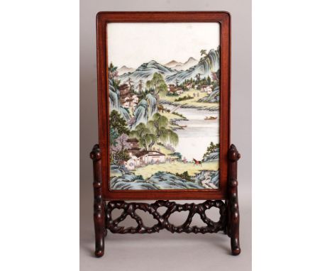 A GOOD QUALITY CHINESE REPUBLIC PERIOD FAMILLE ROSE PORCELAIN SCREEN, in a hardwood frame and supported on a good quality car