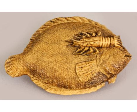 AN UNUSUAL EARLY 20TH CENTURY SIGNED JAPANESE STAINED IVORY NETSUKE OF AN ANGEL FISH, the fish carved in relief with a passin