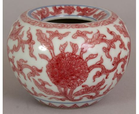 A GOOD QUALITY CHINESE COPPER RED WATER POT, the sides decorated with repeated formal scroll and leaf stemmed flowerheads, th