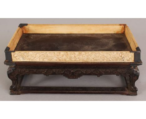 A GOOD 19TH CENTURY CHINESE RECTANGULAR HARDWOOD & IVORY STAND, supported on four scroll feet above connecting stretchers, an