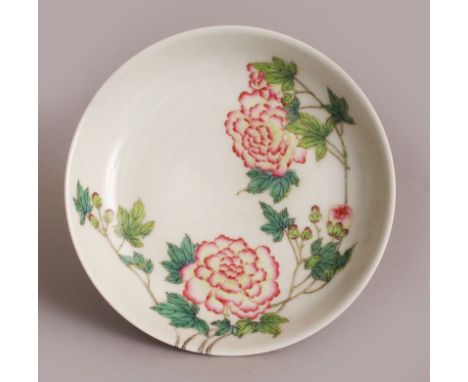 A CHINESE FAMILLE ROSE PORCELAIN SAUCER DISH, the interior and exterior sides decorated with an extended sprig of peony, the 