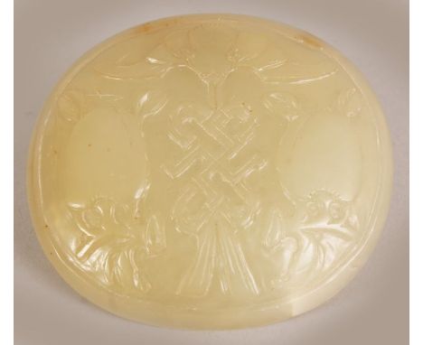 A 19TH/20TH CENTURY CHINESE CELADON JADE OVAL PLAQUE, the slightly domed surface carved with peach, wan & an eternal knot abo