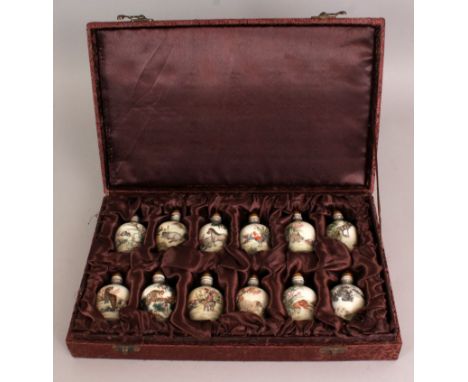 A BOXED SET OF TWELVE CHINESE ANIMAL ZODIAC SNUFF BOTTLES, the base of each snuff bottle with a four-character Qianlong mark,