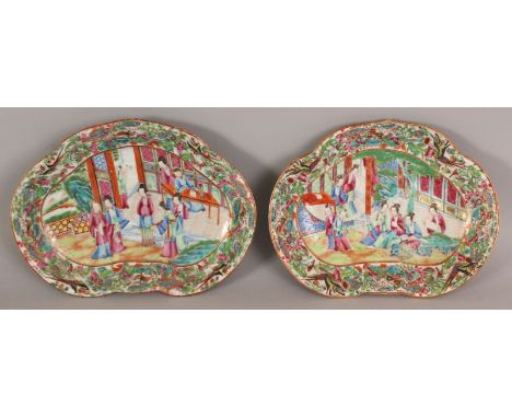 A GOOD PAIR OF 19TH CENTURY CHINESE CANTON MANDARIN RUYI DISHES, each painted in vivid enamels and gilding with a figural ter
