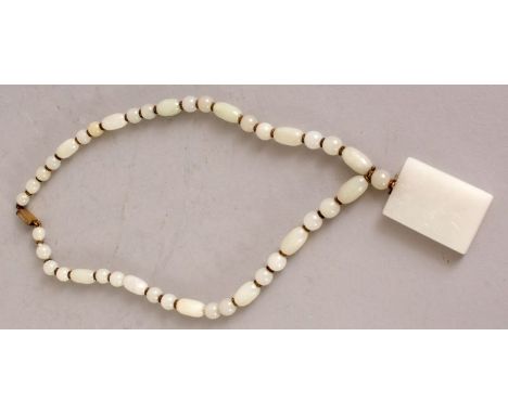 A FINE QUALITY 19TH/20TH CENTURY WHITE JADE PENDANT & NECKLACE, composed of oval and spherical beads with serrated metal divi