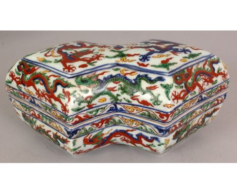 A CHINESE MING STYLE WUCAI PORCELAIN BOX & COVER, of waisted lozenge section, decorated with dragons within scroll borders, t