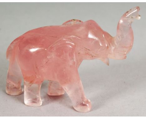 A SMALL CHINESE ROSE QUARTZ MODEL OF A STRIDING ELEPHANT, 2.5in long & 2.2in high.