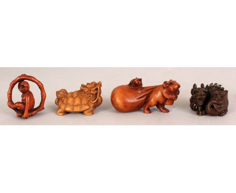 A 20TH CENTURY SIGNED JAPANESE WOOD NETSUKE OF A RAT PULLING A BAG, the bag with a smaller rat seated on top, the base with a