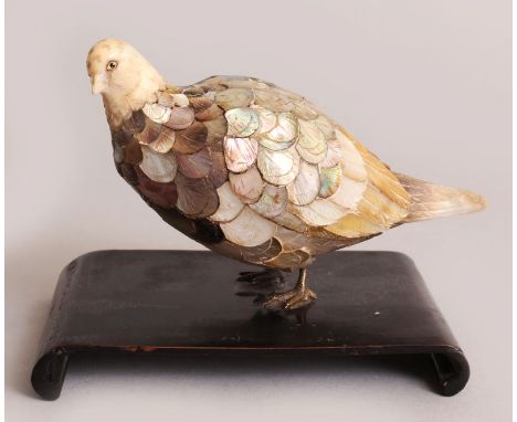 A JAPANESE MEIJI PERIOD MOTHER-OF-PEARL & IVORY MODEL OF A PIGEON, together with a fixed wood stand, the finely carved ivory 