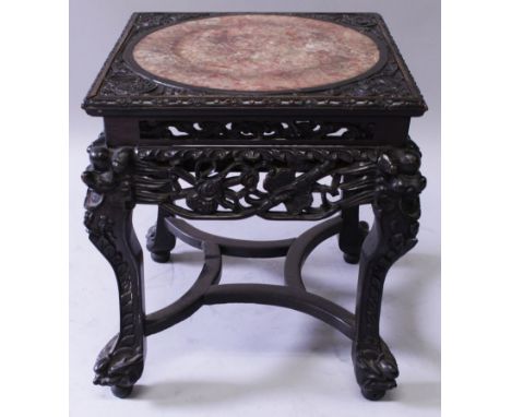 A 19TH CENTURY CHINESE MARBLE INSET HARDWOOD STAND, the square stand inset with a circular marble panel, the stand with a pie