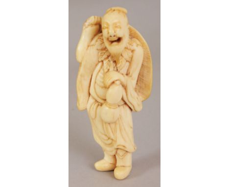 A GOOD QUALITY 18TH CENTURY JAPANESE EDO PERIOD IVORY NETSUKE OF A SENNIN, of larger than average size, standing and holding 