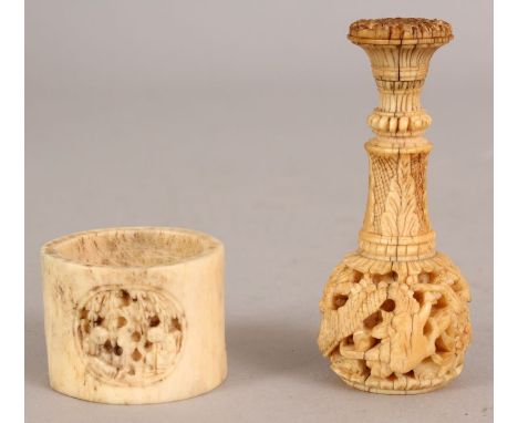 A 19TH CENTURY CHINESE CANTON IVORY SEAL, 2.4in long; together with a Canton ivory napkin ring, 1.25in diameter. (2)