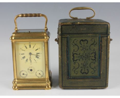A late 19th century French gilt lacquered brass grande sonnerie calendar carriage alarm clock with eight day movement strikin