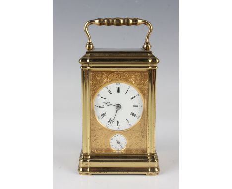 A late 19th/early 20th century French gilt lacquered brass gorge cased carriage alarm clock with eight day movement striking 