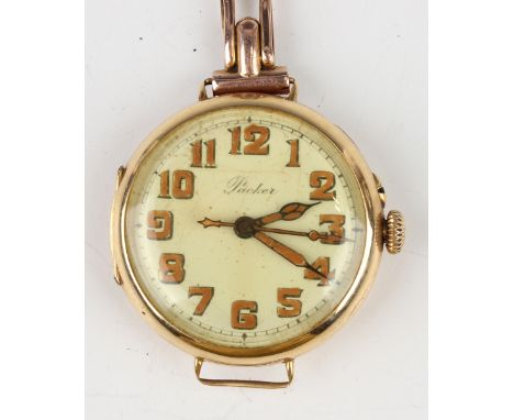 A Packer 18ct gold circular cased wristwatch, the gilt jewelled lever movement detailed 'Swiss Made 15 Jewels', 18ct gold inn