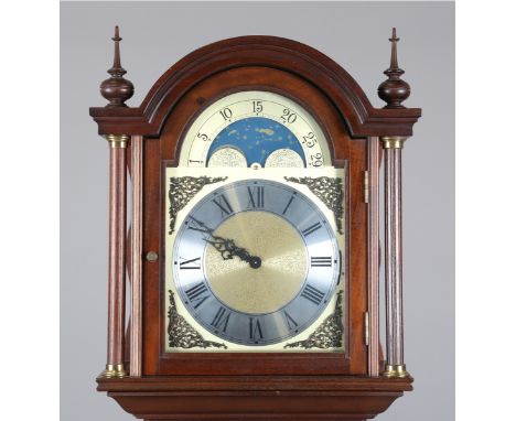 A late 20th century mahogany longcase clock with German weight driven movement chiming on gongs, the breakarch dial with roll