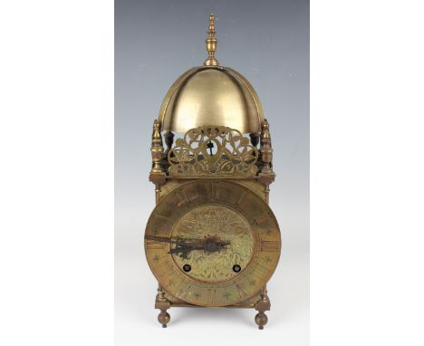 A late 19th century brass lantern clock with eight day movement striking on a bell, the backplate stamped 'W &amp; H Sch' (Wi