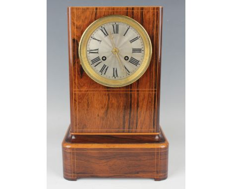 A late 19th century French rosewood mantel clock, the eight day bell strike movement with silk suspension, the silvered circu