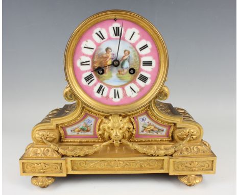 A late 19th century French ormolu and porcelain mantel clock with eight day movement striking hours and half hours on a bell,