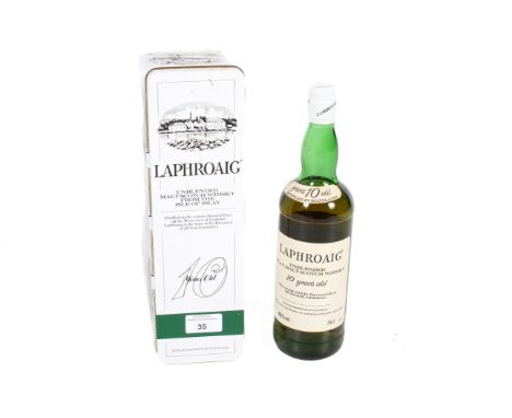 A bottle of 1980s Isle of Islay Laphroaig unblended Scotch whisky. 10 years old, 40% vol, 75cl, in original presentation tin.